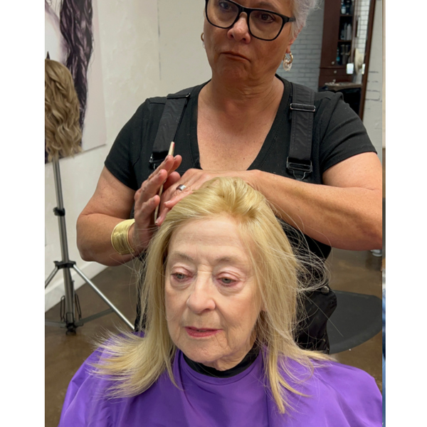 Woman wearing a different hair topper style
